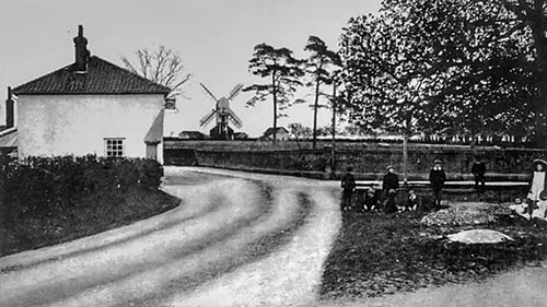 Greyhound pub with distant working mill c.1900