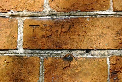 T. Bolding on wall facing mill dam